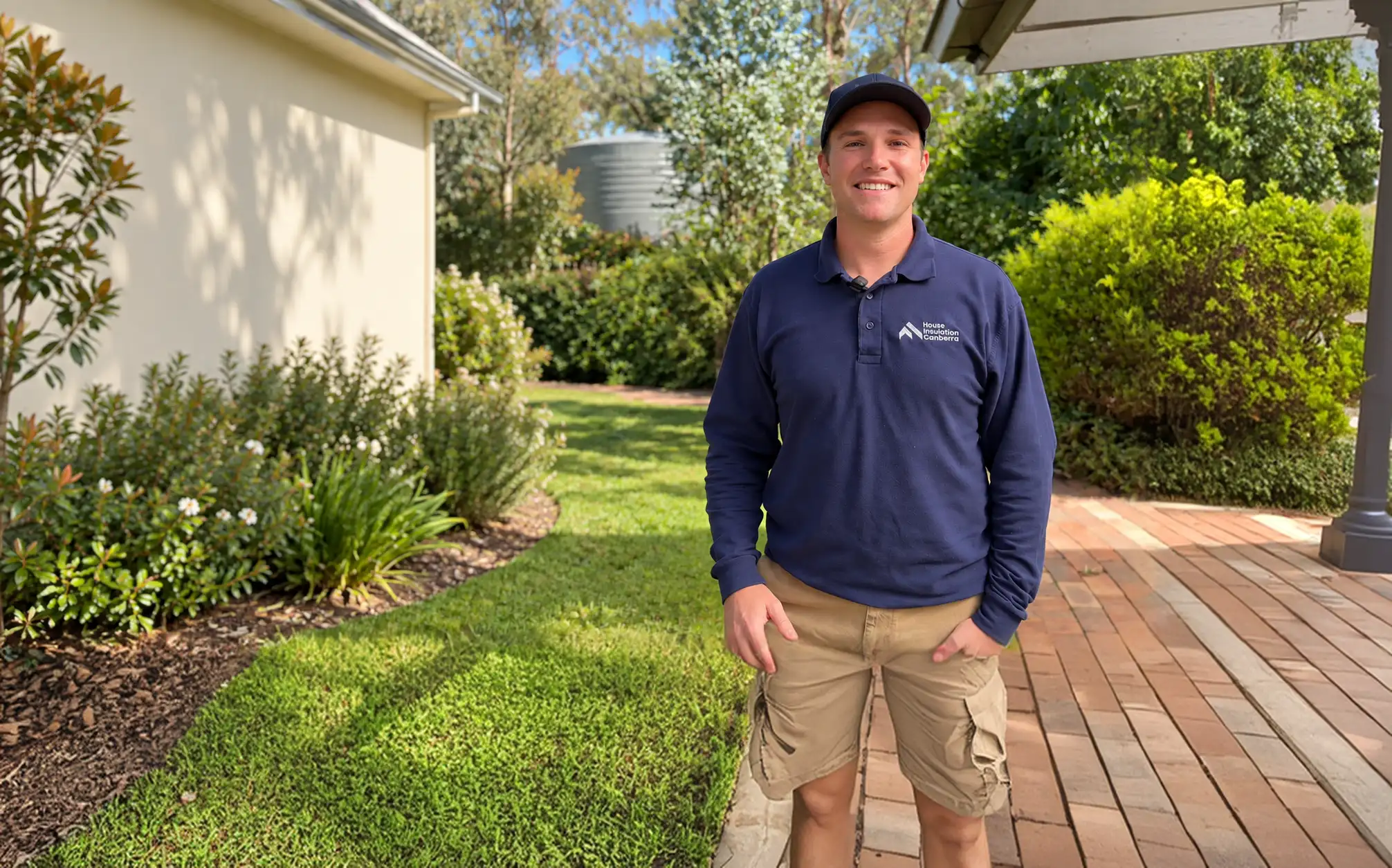Tom from House Insulation Canberra outside a Canberra home