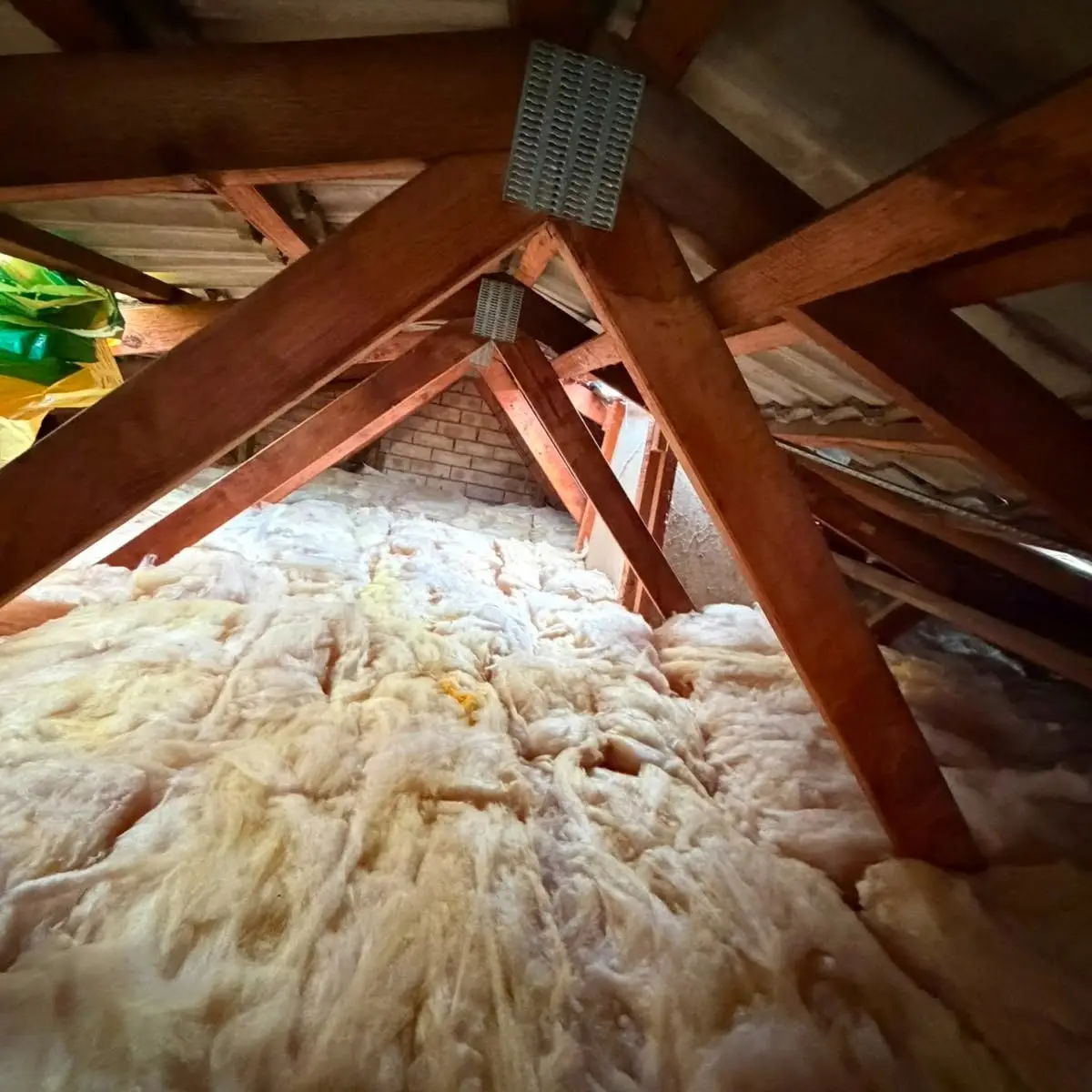 New insulation batts laid across a roof space